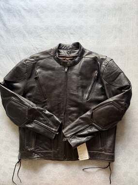 "New With Tags", "Xelement Motorcycle Jacket", "Buffalo Leather" y "Size 2XL".